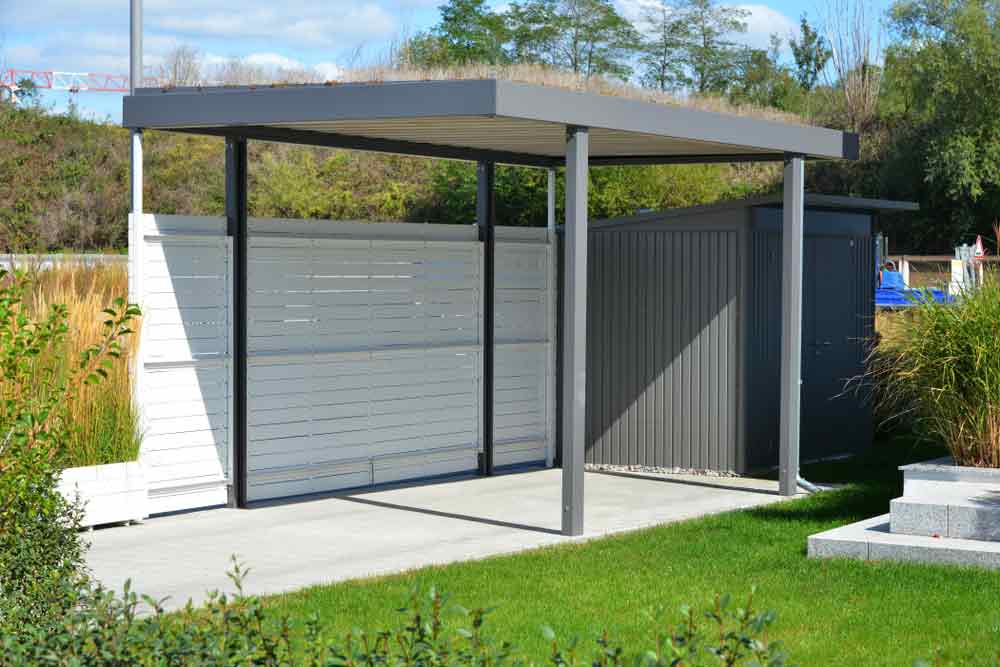 Grey Coloured Steel Sheds In The Backyard