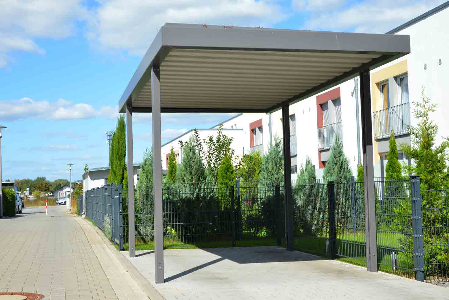 Steel Carport In Front Of A Residential Building